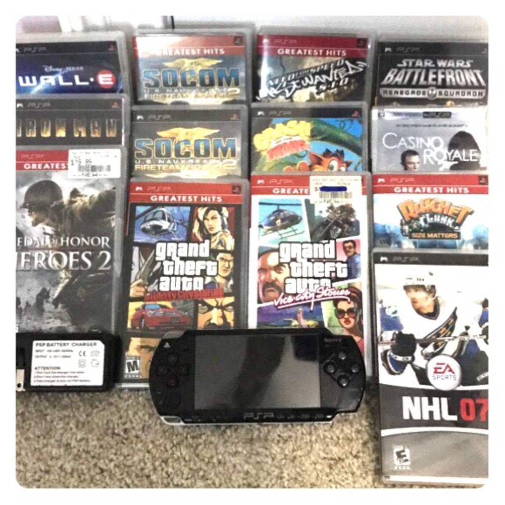 PSP with charger and games